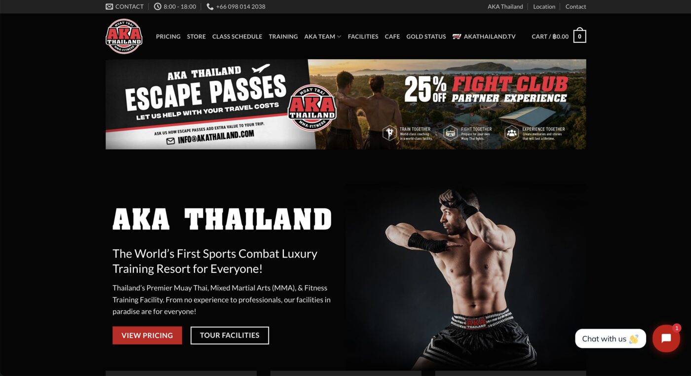 AKA Thailand website homepage, showing a Muay Thai fighter photo alongside training resort messaging.