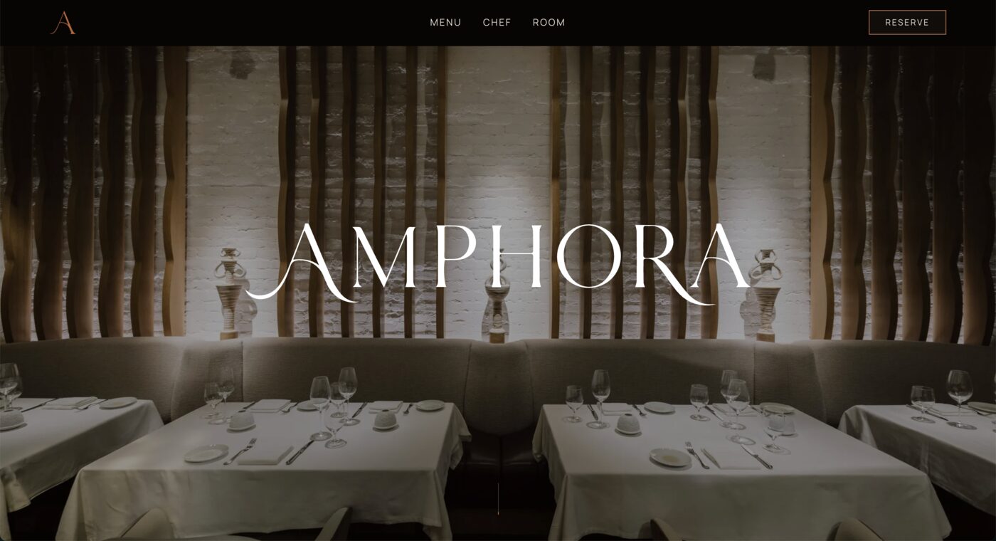 Amphora restaurant website homepage, showing the restaurant name over a dining room photo with a reserve button.